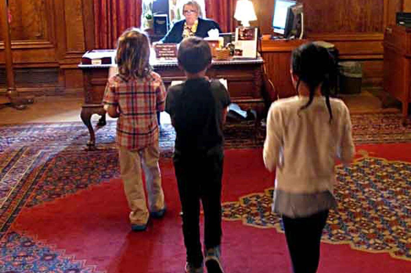 File photo: Children deliver letters written by Philadelphia public school students to the office of Gov. Tom Corbett as part of an effort organized by education groups to secure enough state aid to head off nearly 3,800 layoffs in the state´s largest school district on Wednesday, June 12, 2013, in Harrisburg, Pa. (AP Photo/Marc Levy)
